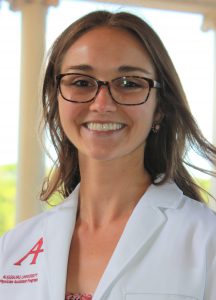 headshot of katie schmitz in a white pa program coat